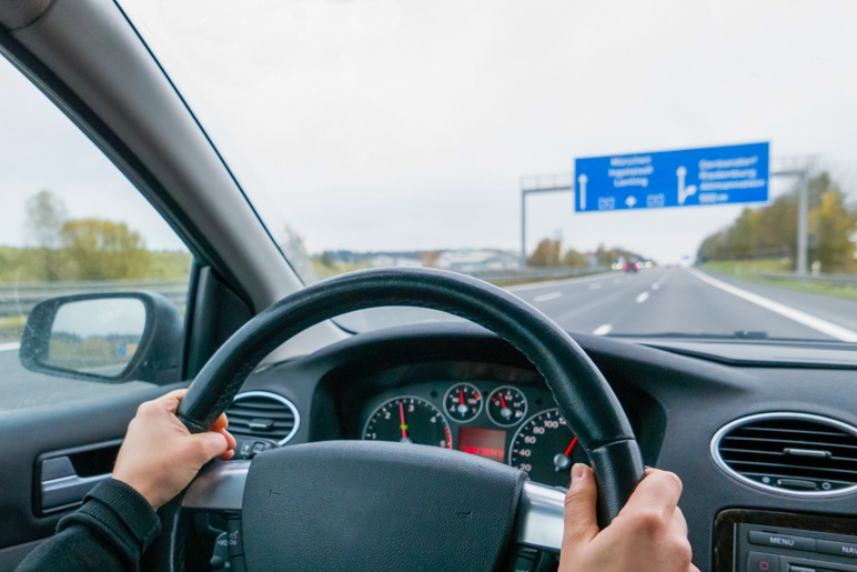 MPU passed - young female driver drives safely and calmly on the highway